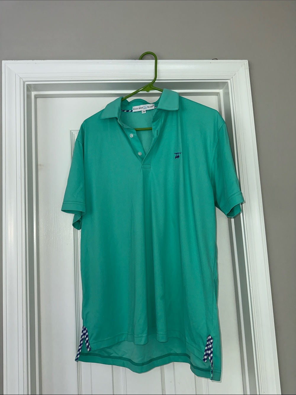 Bald head blues polo shirt